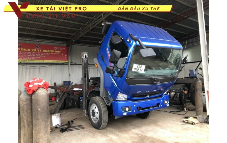 Xe tải Thaco FI170 nâng đầu chở máy công trình có giá bao nhiêu?